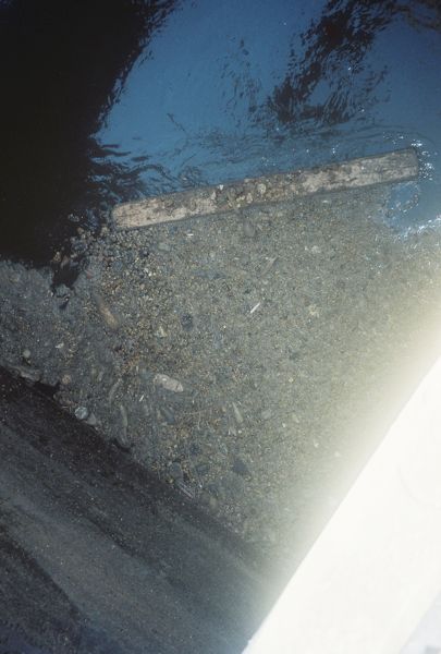 2/7 The waste, grease and oil started reducing and covered a smaller area as time passed; there was a Bboard that flowed into the inlet that  seemed t
