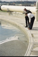 3/7 OSE II was applied to the retention pond as trinity River waste treatment plant personal looked on
